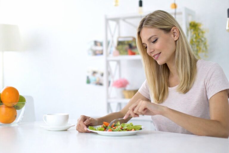 Woman eating a balanced healthy meal at home